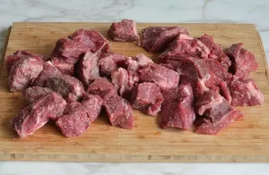 Next, season the meat